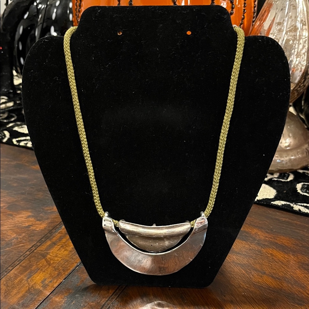 Modern Silver-Tone Crescent Statement Necklace on Olive Woven Cord